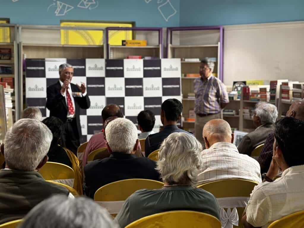 Wing Commander Joseph Thomas giving a talk in front of the audience